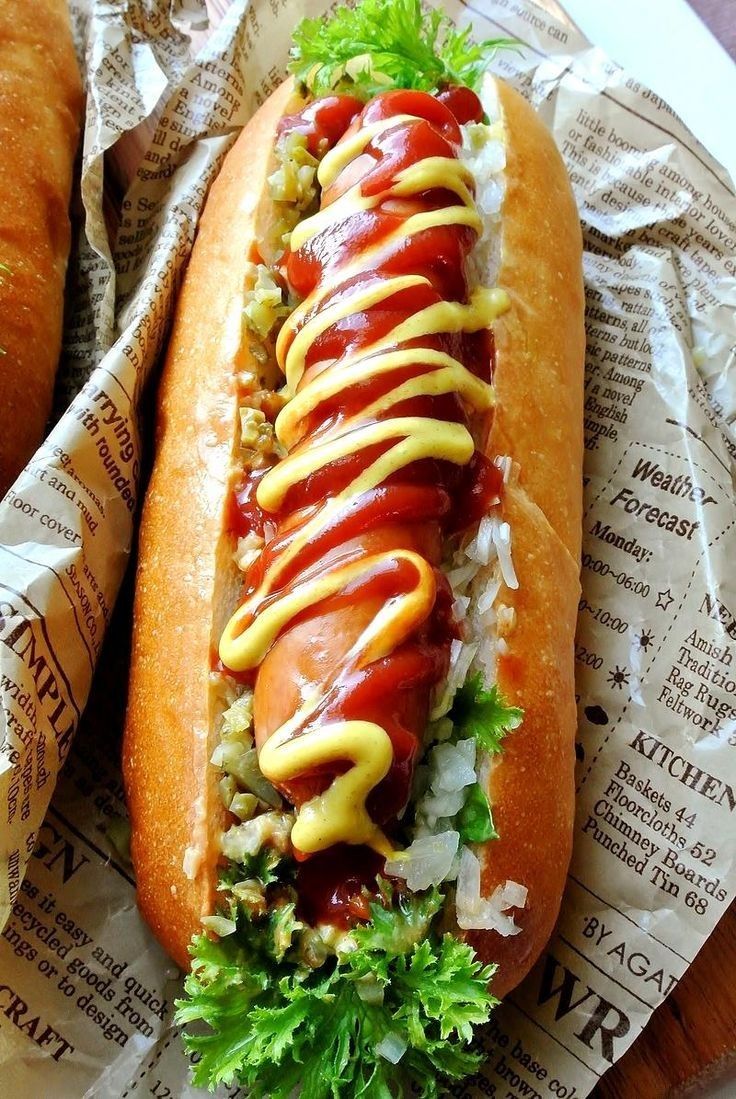 Four Hot Dogs on Buns with Condiments